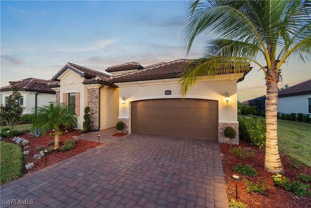 mediterranean / spanish-style home featuring a garage