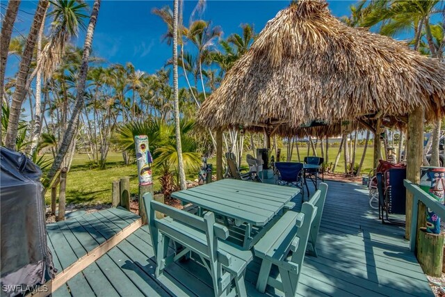 wooden terrace featuring a gazebo