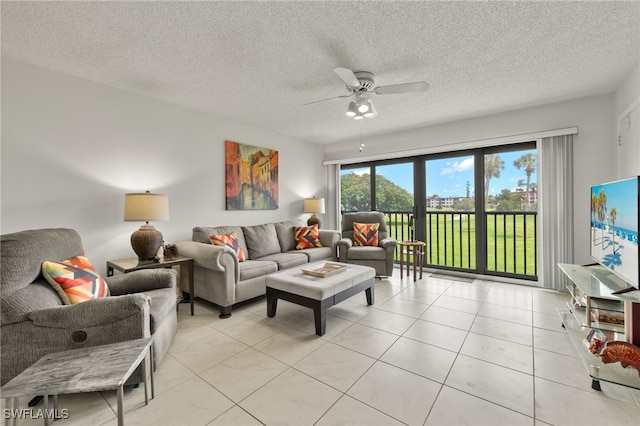 tiled living room featuring a textured ceiling and ceiling fan