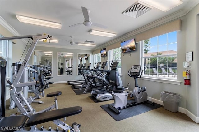 workout area with ornamental molding, visible vents, ceiling fan, and baseboards