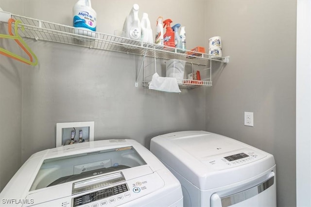 laundry room featuring laundry area and washing machine and clothes dryer