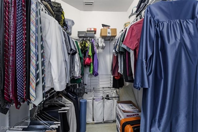 walk in closet featuring carpet floors and visible vents