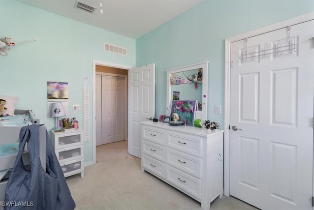 bedroom featuring light colored carpet and visible vents