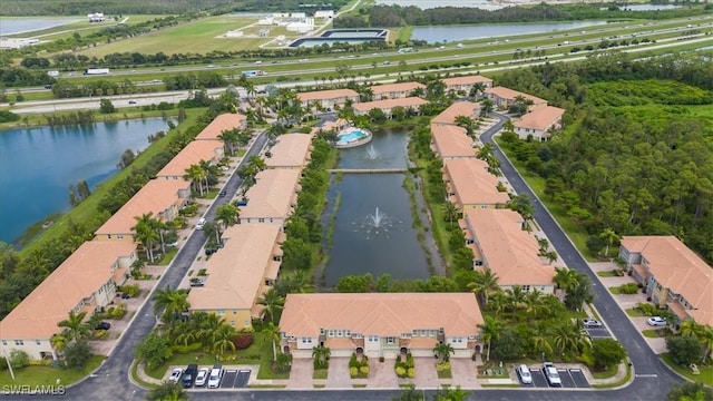 bird's eye view featuring a residential view and a water view