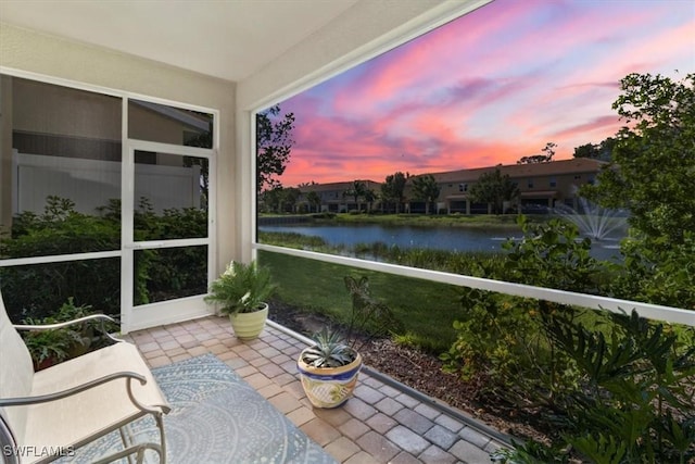 sunroom with a water view