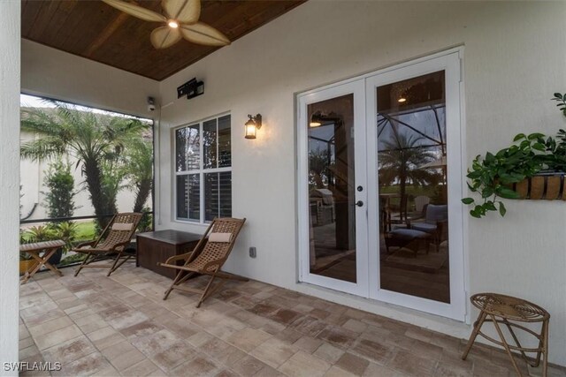 view of patio with french doors and ceiling fan