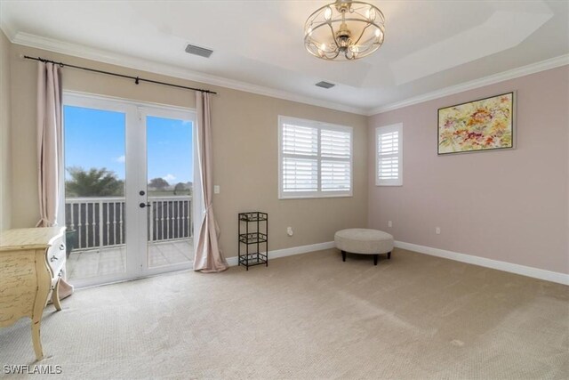 living area with carpet floors, a raised ceiling, and crown molding