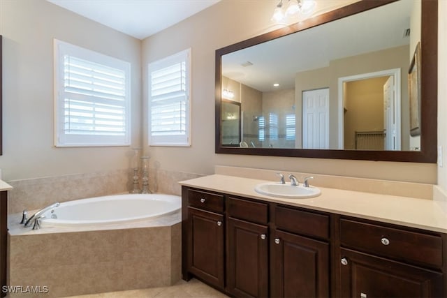 bathroom with vanity, tile patterned floors, and independent shower and bath