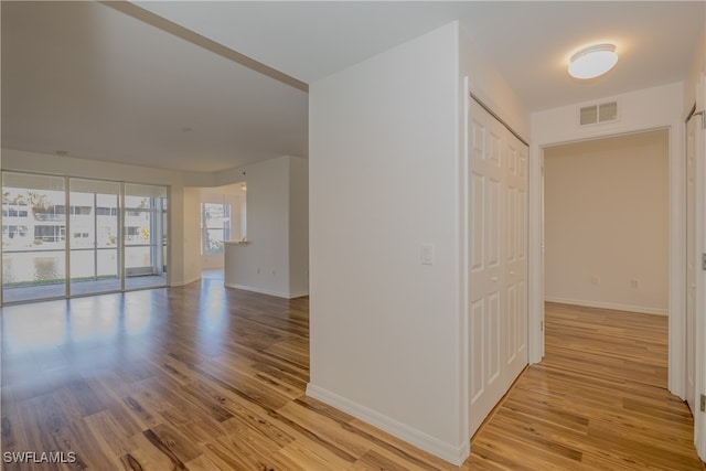 spare room featuring light hardwood / wood-style floors