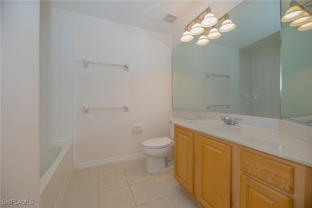 full bathroom featuring toilet, tiled shower / bath, vanity, and tile patterned floors