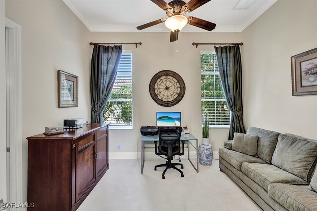 carpeted office space with a wealth of natural light and ceiling fan