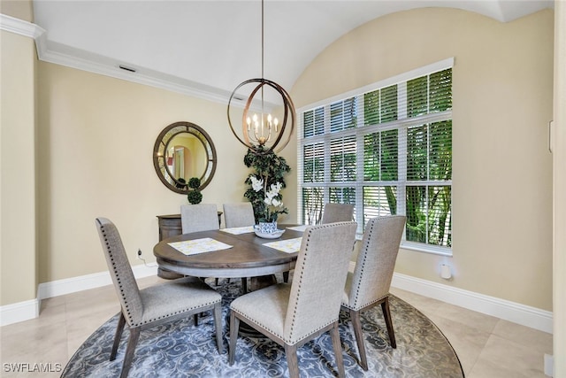 tiled dining space featuring an inviting chandelier and crown molding