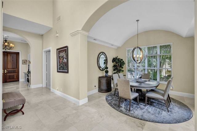 dining room featuring lofted ceiling and a notable chandelier