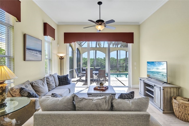 living room featuring ceiling fan and crown molding