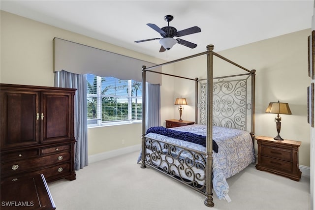 bedroom featuring ceiling fan and light colored carpet