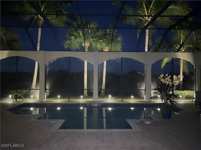 pool at twilight with glass enclosure