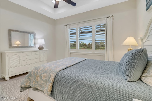 bedroom with hardwood / wood-style flooring and ceiling fan