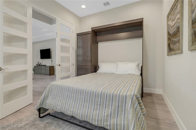 bedroom featuring light hardwood / wood-style flooring