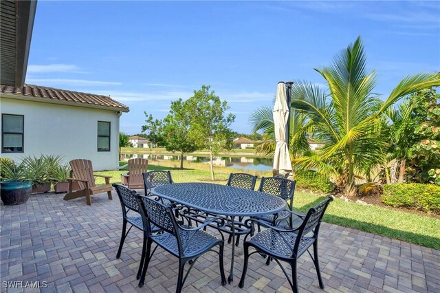 view of patio featuring a water view