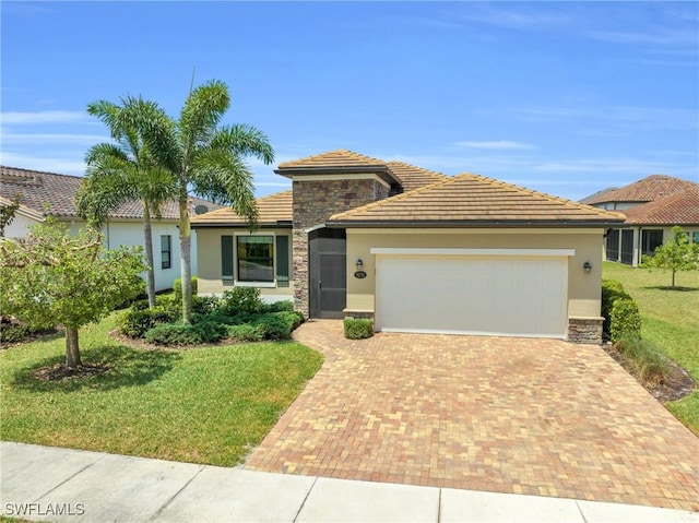 view of front facade with a garage and a front lawn