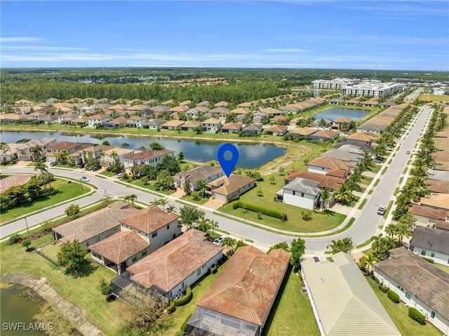 birds eye view of property featuring a water view