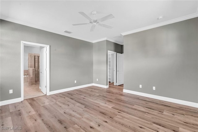 unfurnished room featuring ceiling fan, ornamental molding, and light wood-type flooring