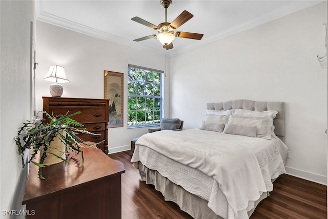 bedroom featuring ceiling fan, dark hardwood / wood-style floors, and ornamental molding