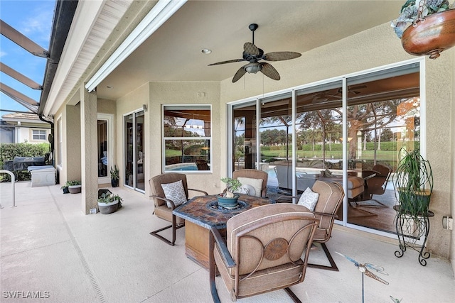 view of patio / terrace featuring ceiling fan