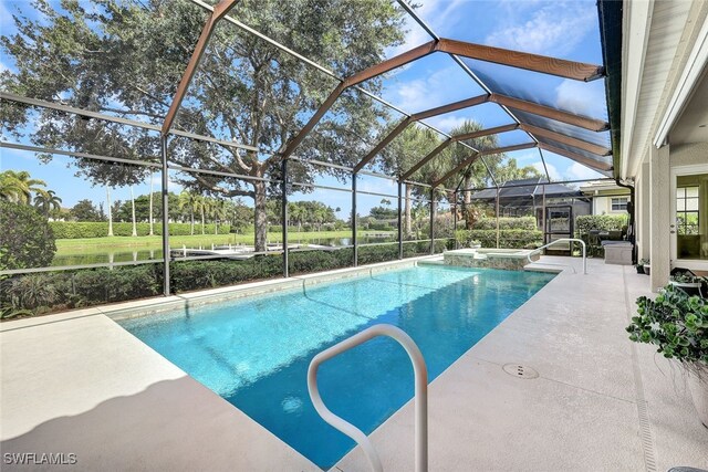 view of swimming pool featuring an in ground hot tub, a patio area, and a lanai