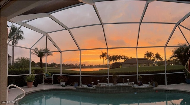 pool at dusk with glass enclosure