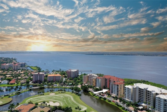 aerial view at dusk with a water view