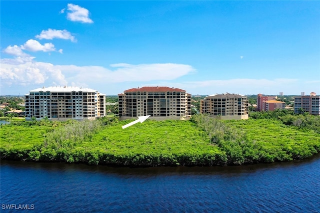 birds eye view of property featuring a water view