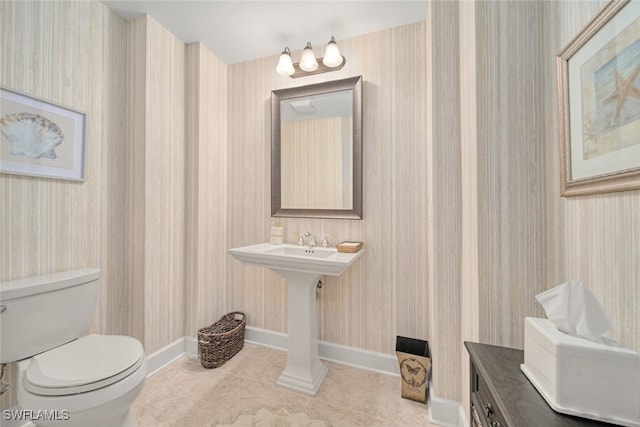 bathroom featuring toilet and tile patterned floors