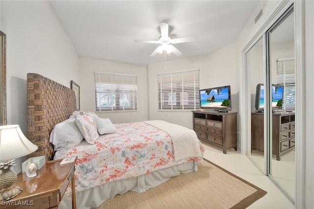 carpeted bedroom featuring a closet and ceiling fan