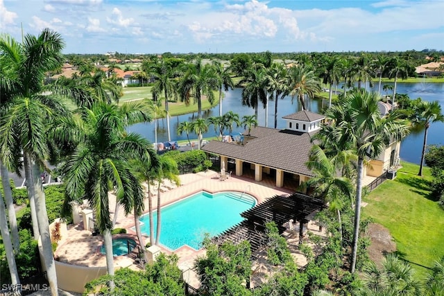 view of pool featuring a patio area and a water view