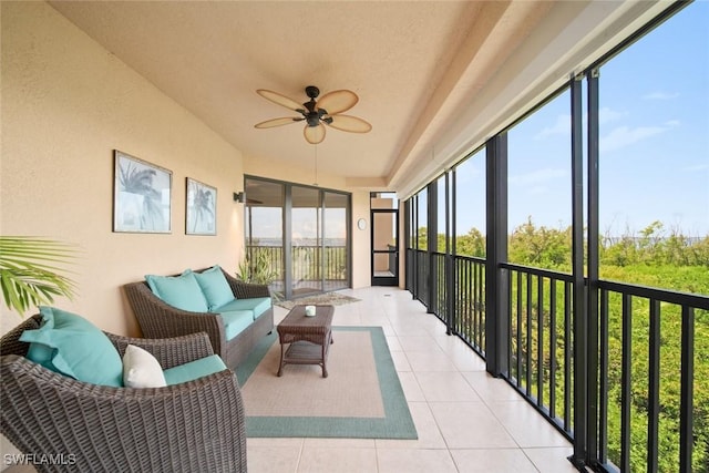 sunroom / solarium featuring ceiling fan