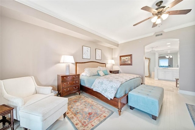 bedroom with ceiling fan, crown molding, ensuite bath, and light hardwood / wood-style flooring