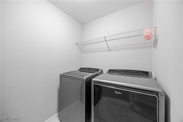 laundry room featuring separate washer and dryer