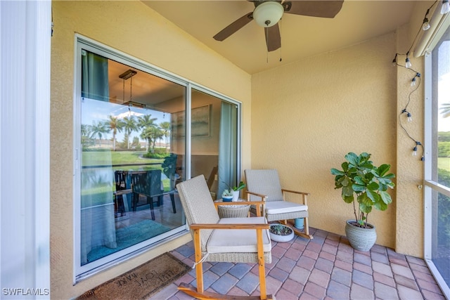 exterior space with a wealth of natural light and ceiling fan