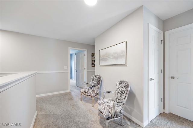 sitting room with light colored carpet