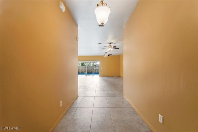 hallway featuring light tile patterned flooring