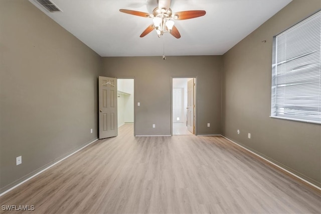 spare room with light hardwood / wood-style flooring and ceiling fan