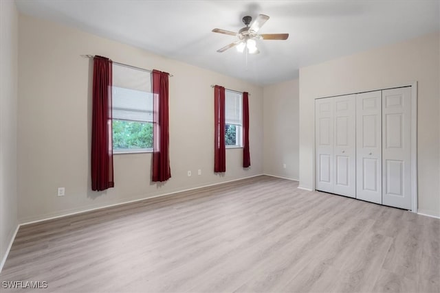 unfurnished bedroom with a closet, ceiling fan, and light hardwood / wood-style floors