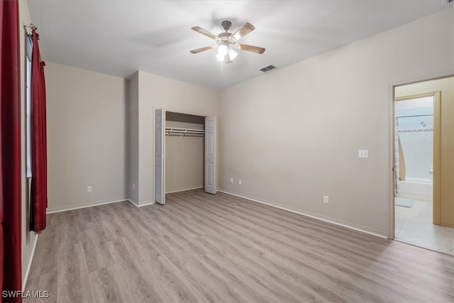 unfurnished bedroom with ceiling fan, a closet, and light hardwood / wood-style floors