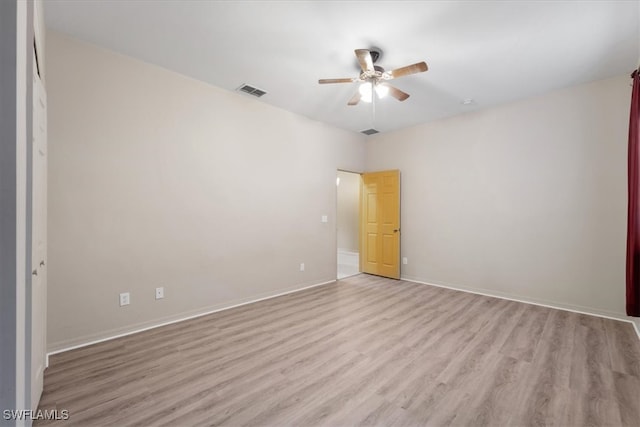 unfurnished room featuring ceiling fan and light hardwood / wood-style floors