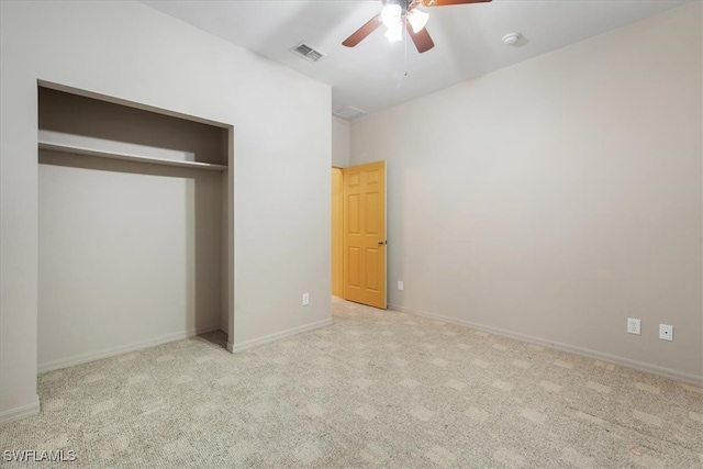 unfurnished bedroom featuring a closet, ceiling fan, and light carpet