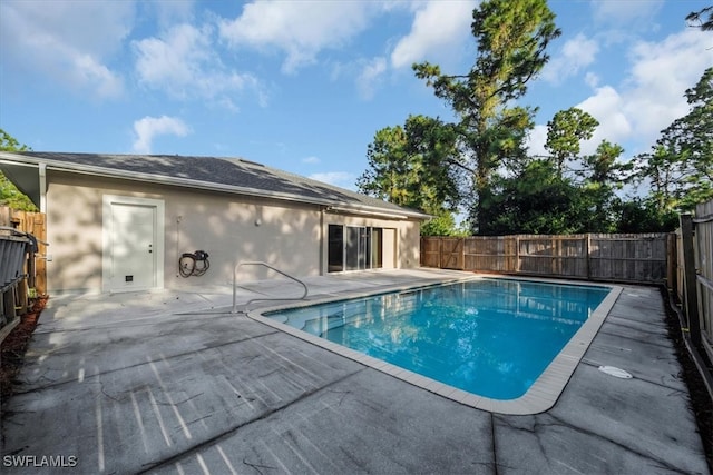 view of swimming pool with a patio area