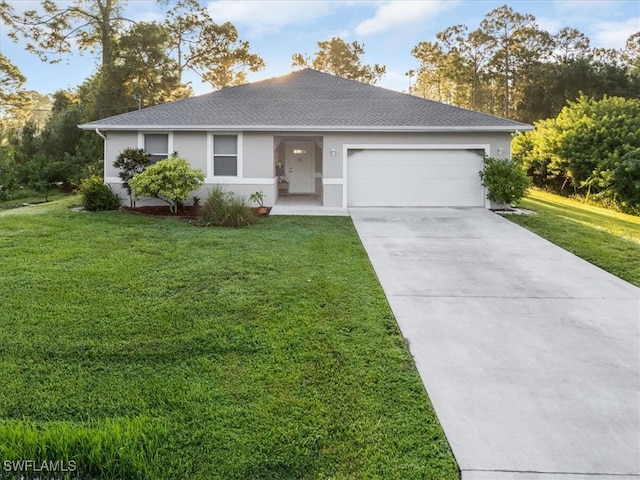 ranch-style house featuring a garage and a front lawn