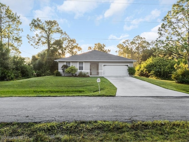 view of front of home featuring a garage and a front lawn