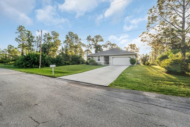 view of front facade with a garage and a front lawn